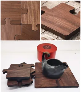 Detail of puzzle-shaped walnut wood coasters showing natural grain and interlocking edges