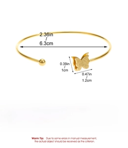 Detail of gold titanium steel open bangle showing brushed butterfly design and 6.2g weight