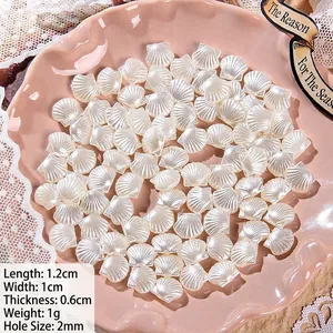 Macro shot of white shell-shaped ABS baroque pearl beads for DIY jewelry making