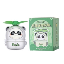 Mini ventilatore a forma di panda bianco e grigio con pale verdi e scatola di carta originale