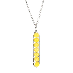 Detail of handmade wire-wrapped colorful crystal beads in a U-shaped silver pendant