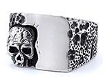 Detail of vintage gothic skull ring in retro silver finish with punk style texture