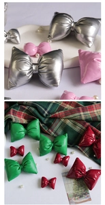 Close-up of metallic Christmas bows in various colors for gift box DIY decoration