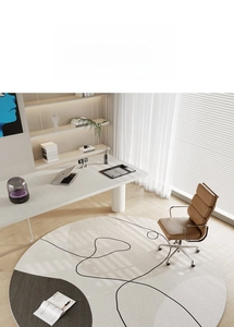 Detail view of round minimalist area rug with modern abstract black lines and grey shapes