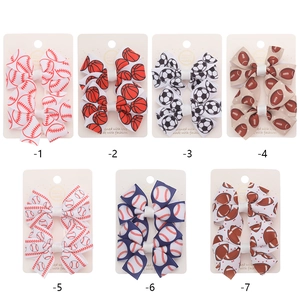 Set of 7 sports themed bow hair clips with baseball basketball soccer football prints