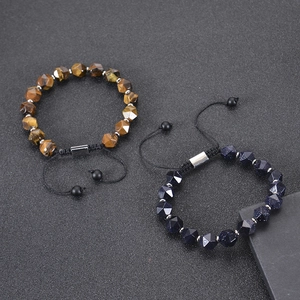 Detail of faceted Tiger Eye and Blue Goldstone beads on adjustable woven bracelets