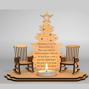 Detail of wooden Christmas tree memorial plaque with rocking chairs and candle