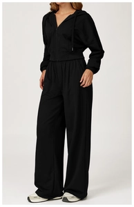 Detail of high-waist wide-leg sweatpants and cropped hoodie in soft black cotton