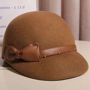 Elegant caramel wool equestrian cap with side bow and rhinestone leather strap detail