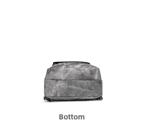 Detailed bottom view of gray textured crossbody bag with durable black reinforced edges