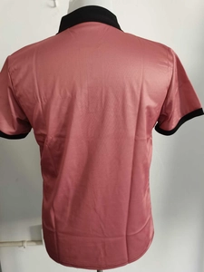 Macro shot of breathable mesh fabric on the back of a dusty rose men's polo shirt