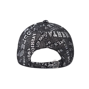 Detail of adjustable metal buckle and metallic alphabet print on black baseball cap