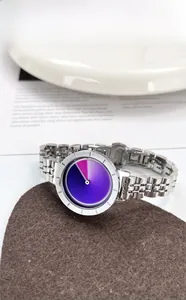 Detail view of silver stainless steel strap and purple-blue gradient minimalist dial