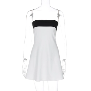 Detail of color-block patchwork on black and white strapless bodycon mini dress