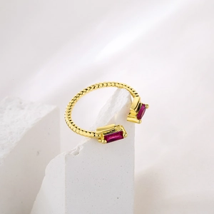 Minimalist gold-plated open ring with twisted band and red rectangular zircon gems