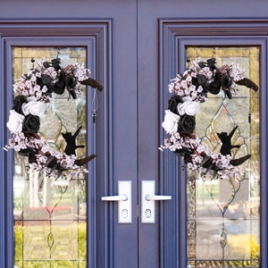 Halloween crescent moon wreath with black and white roses and a cat silhouette