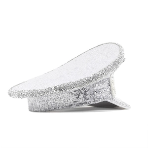 Close-up of sparkling silver sequins and white pearls on a festive bridal captain hat