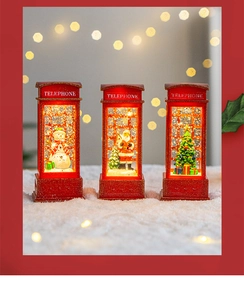 Detailed view of Christmas telephone booth snow globe lantern with festive LED lights.