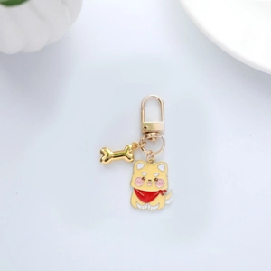 Cute cartoon shiba inu dog metal keychain with gold bone charm and red scarf detail
