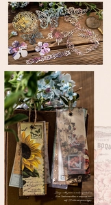 Detail of vintage scrapbooking paper with butterfly cutouts and sunflower floral labels