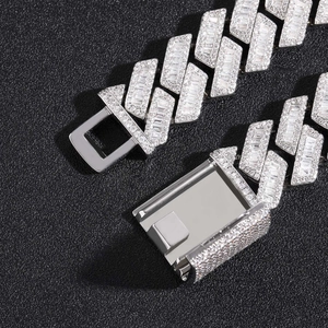 Macro shot of 20mm silver Cuban link necklace with square clasp and paved zircon stones
