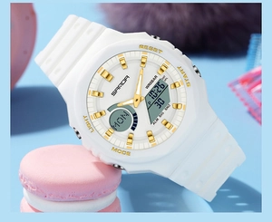 Detailed close-up of a white dual-display sports watch with gold accents and 50m water resistance