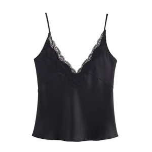 Detailed close-up of delicate black lace trim on a satin camisole top for women
