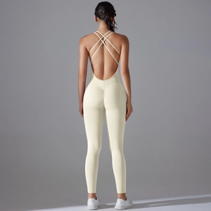 Detail of cream-colored bodysuit with ruched scrunch butt design and crisscross back straps