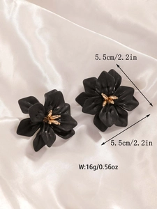 Detail view of large matte black acrylic flower earrings with 5.5cm size dimension