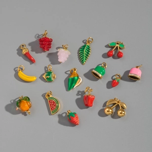 Detail of assorted fruit pendants in 18K gold-plated stainless steel with enamel