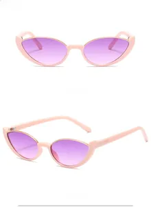 Detail view showing pink cat-eye sunglasses with gradient purple lenses and side accents