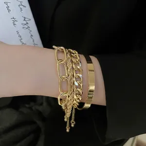Chic 4-piece gold layered chain and bangle set for women with polished metal finish