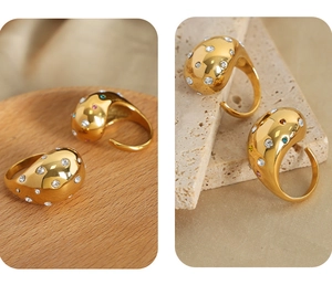 Detailed macro view of gold-plated titanium steel ring with colorful teardrop gemstones