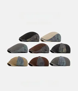 Macro view of washed denim patchwork newsboy caps in eight vintage colors with metal buckles