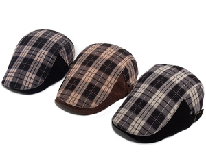 Close-up of vintage plaid corduroy newsboy caps in black, grey, and coffee brown colors
