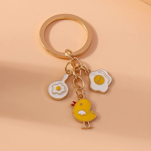 Cute golden frying pan egg and chick keychain accessory for bags and phones