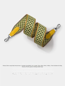 Detail of yellow and green zigzag waxed thread shoulder strap with silver buckle