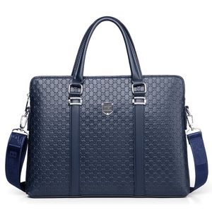 Dark blue business briefcase with embossed leather pattern and detachable shoulder strap