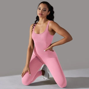 Close-up of pink seamless ribbed fabric on a one-piece slimming yoga bodysuit