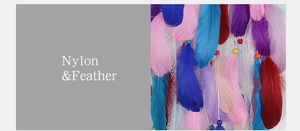 Detail of colorful feathers and nylon lace craftsmanship on unicorn dreamcatcher