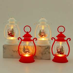 Christmas LED lantern ornaments with Santa and Snowman patterns on marble steps