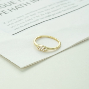 Detail view of gold S925 sterling silver ring showing intricate hallmark and pave zircon stones
