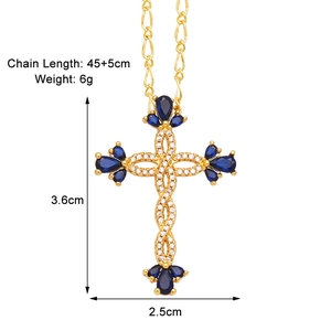 Detail view of gold cross pendant with blue stones, chain 45+5cm, size 3.6x2.5cm