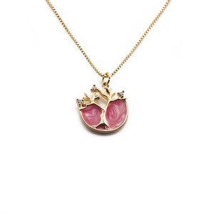 Gold-plated necklace with pink enamel tree pendant and small diamonds on a box chain