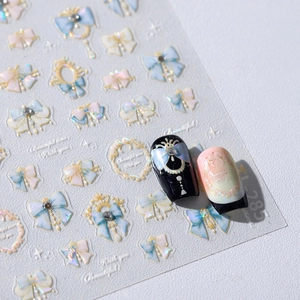 Autocollants 3D pour ongles nœuds de ruban de Noël et étoiles dorées modèle TL-285