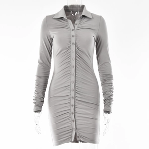 Close-up of grey long-sleeved bodycon dress with collar and button-down pleated detail