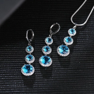 Water drop jewelry set with blue zircon necklace and matching earrings on black background