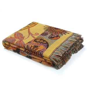 Knitted sun and moon pattern throw blanket with fringe edge on white background