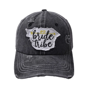Distressed dark grey denim baseball cap featuring white bride tribe embroidered patch
