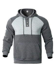 Detailed close-up of buttoned collar and drawstring hood on gray sport hoodie